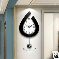 Horloge murale moderne Garvee, à piles, en forme de goutte d'eau, pour salon, chambre, cuisine, bureau, 39 x 73 cm, élégante