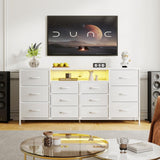 Meuble TV Garvee 63" pour téléviseurs de 65 à 75 pouces, avec 12 tiroirs, éclairage LED, revêtement en tissu, chargeur, étagères ouvertes, mobilier de salon moderne - Blanc