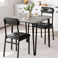 Ensemble table et chaises Garvee pour 2 personnes, avec chaises rembourrées, MDF et métal, compact pour petits espaces, gris vintage et noir.