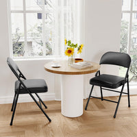 Ensemble de 2 chaises pliantes Garvee avec coussins, revêtement en similicuir, structure métallique robuste, pour une utilisation intérieure et extérieure, couleur noire, pliables, capacité de charge jusqu'à 159 kg