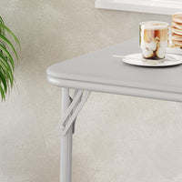 Table pliante Garvee 85,3 cm (33,6 po) avec coussin en PU, cadre en métal, pieds antidérapants, idéale pour le bureau et le camping, portable, noire