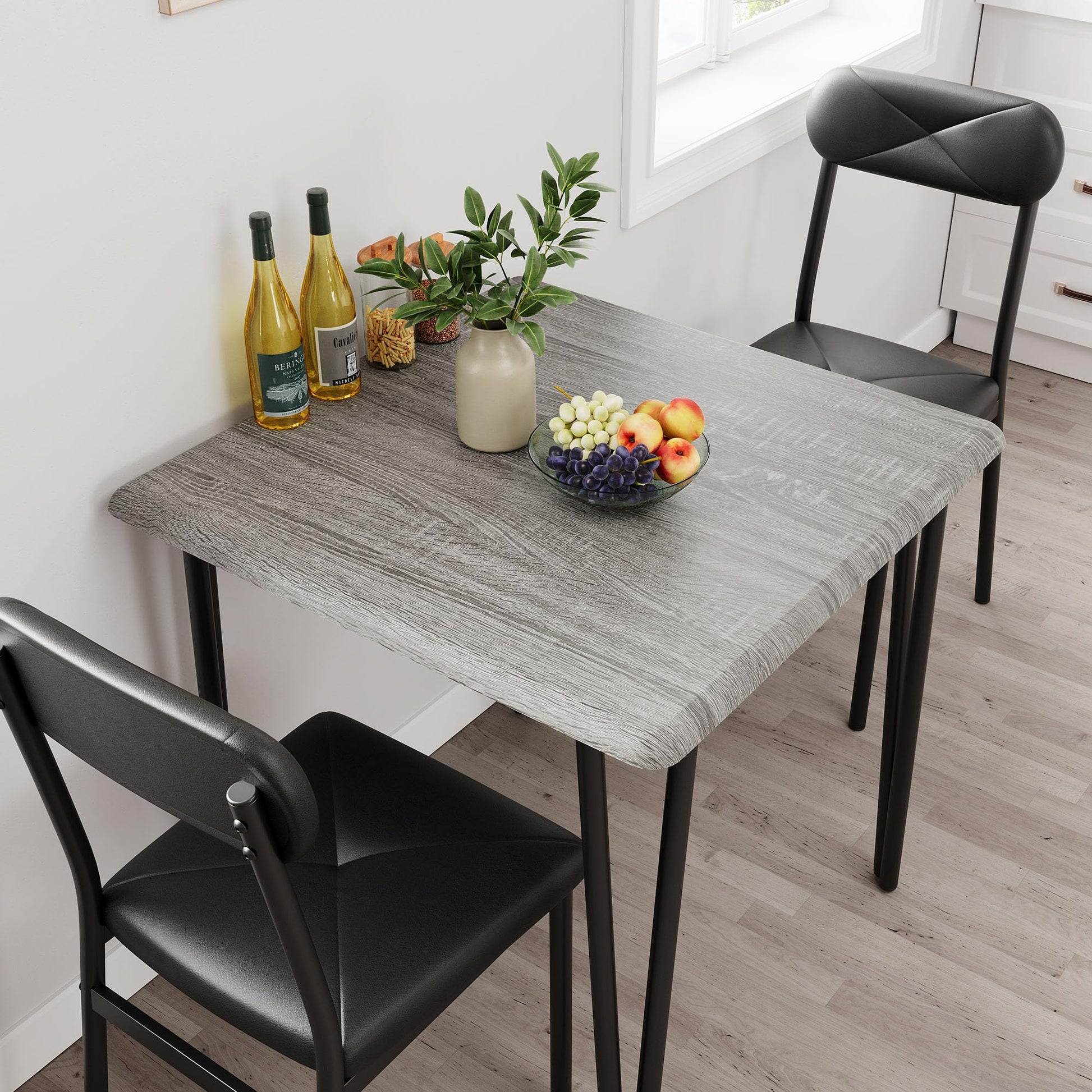 Ensemble table et chaises Garvee pour 2 personnes, avec chaises rembourrées, MDF et métal, compact pour petits espaces, gris vintage et noir.
