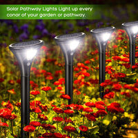Lot de 4 lampes solaires d'extérieur Garvee avec détecteur de mouvement, étanches IP65, pour jardin, terrasse, pelouse et allée.
