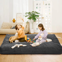 Pouf Garvee grand modèle en velours côtelé, housse pliable et lavable 2 en 1, gris foncé, pour salon ou chambre.