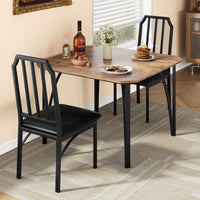 Ensemble table et chaises Garvee pour 2 personnes, design biseauté, chaises rembourrées en PU, structure en MDF et acier, compact, idéal pour les petits espaces, 111 x 70 x 78 cm, noir
