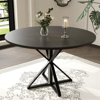 Table de salle à manger ronde Garvee de 119 cm (47 pouces) avec piètement en métal, idéale pour la cuisine et la salle à manger. Plateau en MDF résistant aux rayures et antidérapant, pouvant accueillir 4 à 6 personnes.