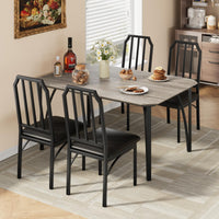 Ensemble table et chaises Garvee pour 4 personnes, design biseauté, coussins d'assise en polyuréthane, structure en MDF et acier, compact et robuste, idéal pour les petits espaces, noir.