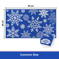 Tapis de porte Garvee Kerst 50x80 cm, lavable et antidérapant, motif flocons de neige rouges et bleus, idéal pour l'entrée, la cuisine ou la chambre à coucher. Décoration de Noël.