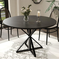 Table de salle à manger ronde Garvee de 119 cm (47 pouces) avec piètement en métal, idéale pour la cuisine et la salle à manger. Plateau en MDF résistant aux rayures et antidérapant, pouvant accueillir 4 à 6 personnes.
