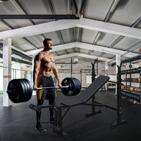 Banc de musculation olympique Garvee, réglable avec extension des jambes et coussin pour curl, idéal pour l'entraînement à domicile. Structure en métal, pliable, revêtement en cuir, stable, capacité de 150 kg.